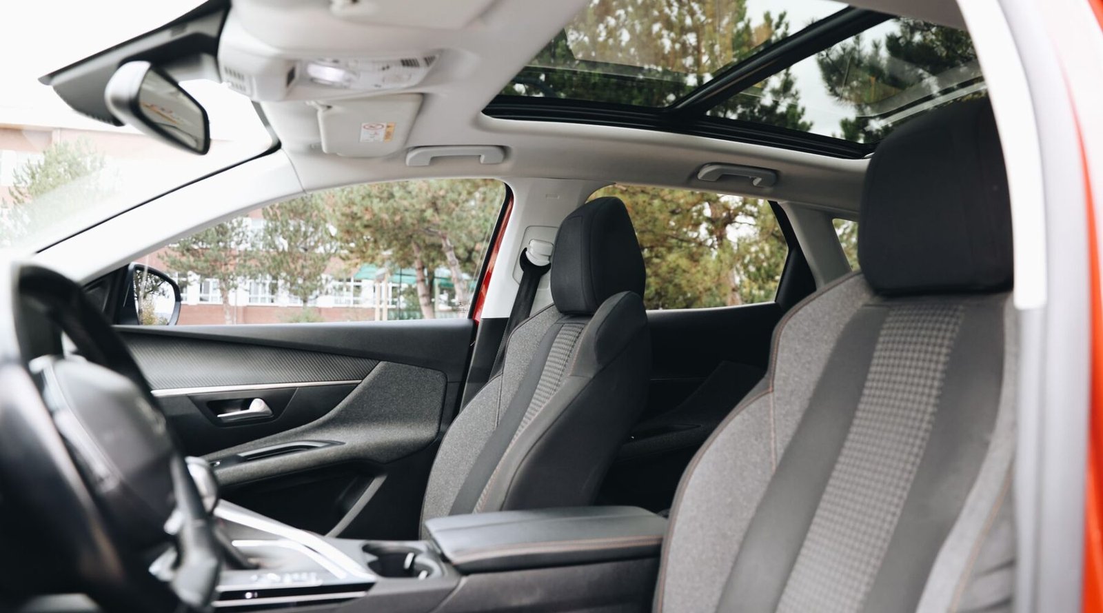 The best new cars for tall drivers balance legroom, seat travel, and roofline architecture